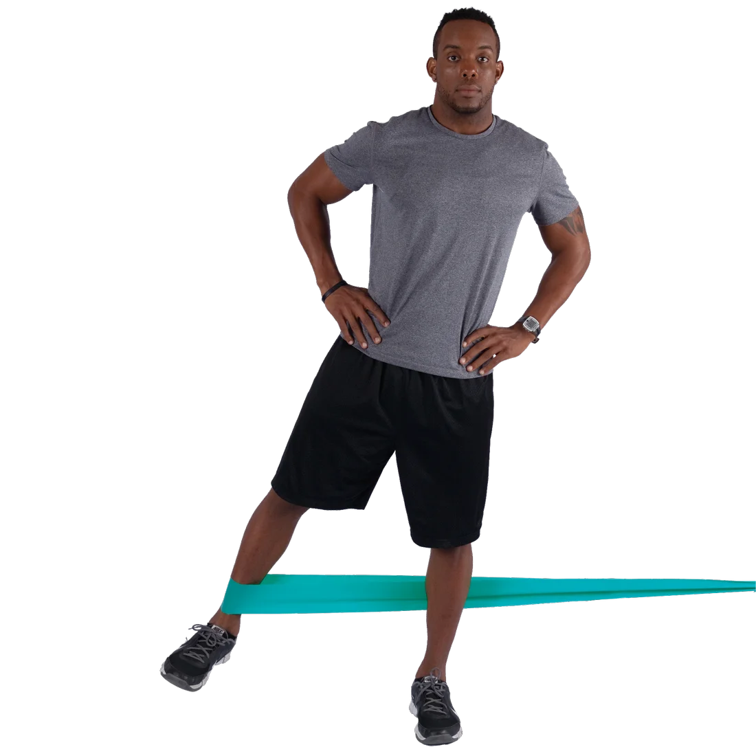 Man using Spirit Fitnessband 13.5 kg latex-free resistance band (183x10 cm) for leg exercise; turquoise band stretched around ankles, suitable for strength and rehabilitation training.
