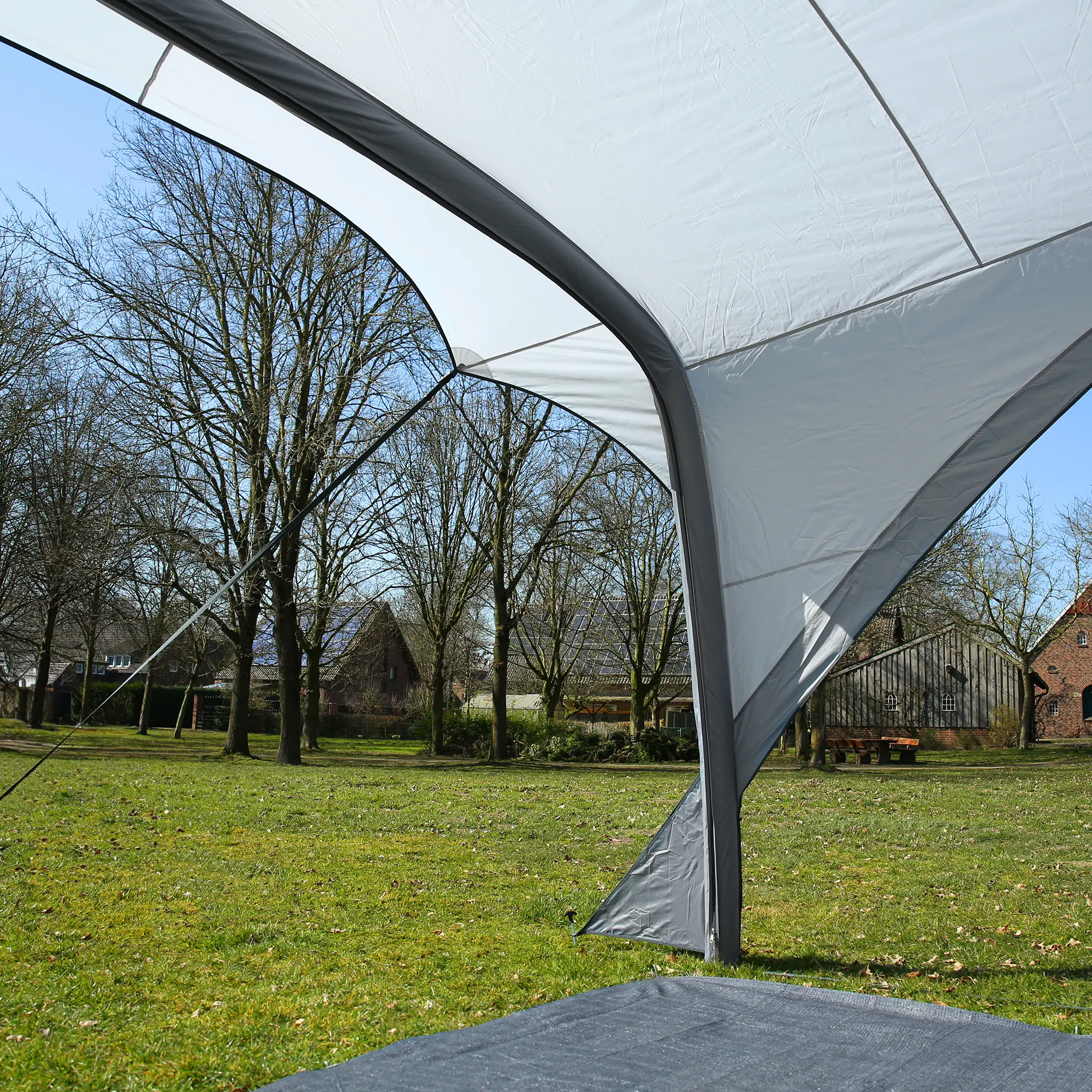 Inflatable your GEAR Amalfi Air 360 caravan sun canopy, tailored fit for Hobby Beachy caravans, shown outdoors with grey, curved structure and tensioned fabric for optimal shade and weather protection.