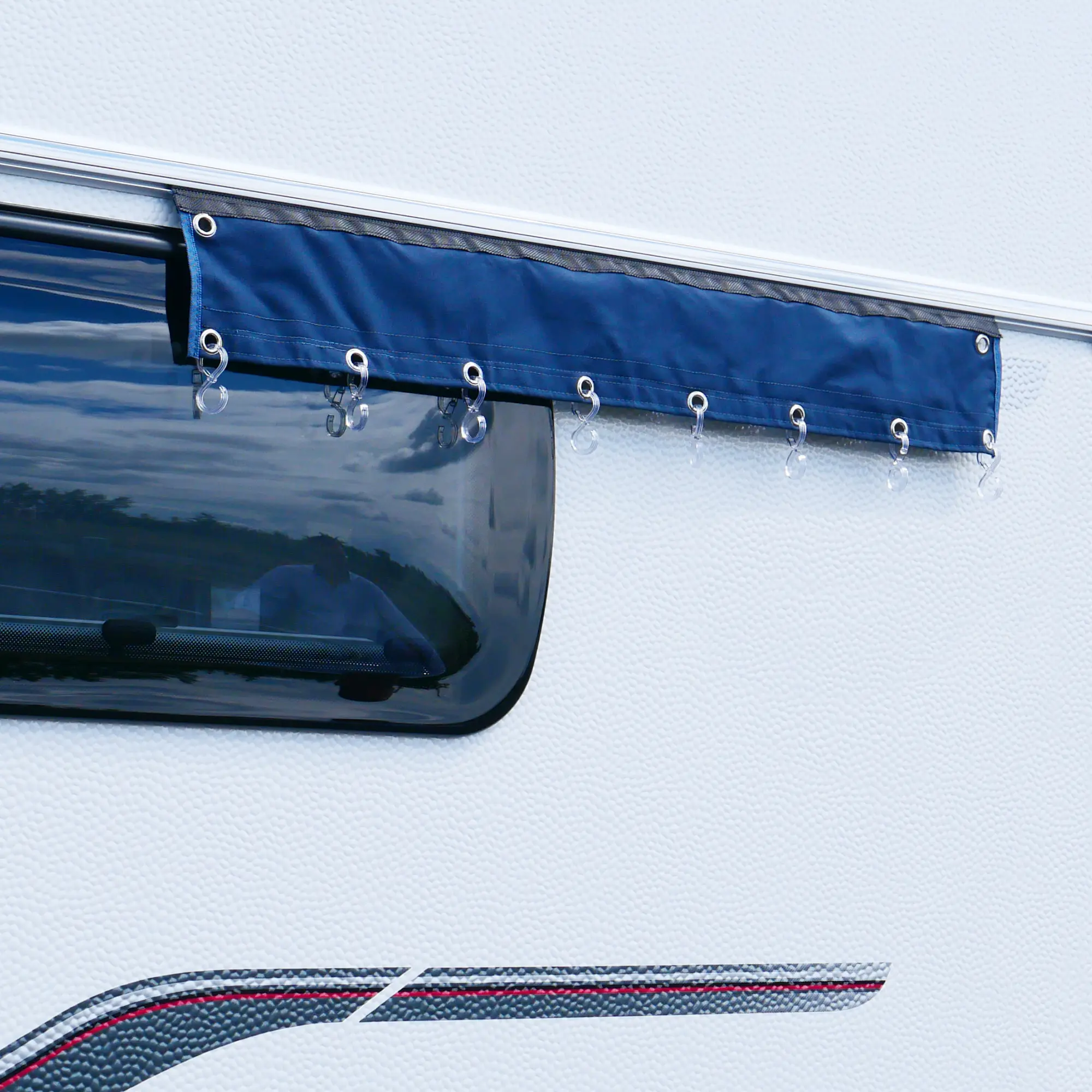 Blue your GEAR Caravan Organizer Hook rail, 100 cm long with 8 clear hooks, mounted on a caravan wall above a window, designed for tents, awnings, or campers to organize items.