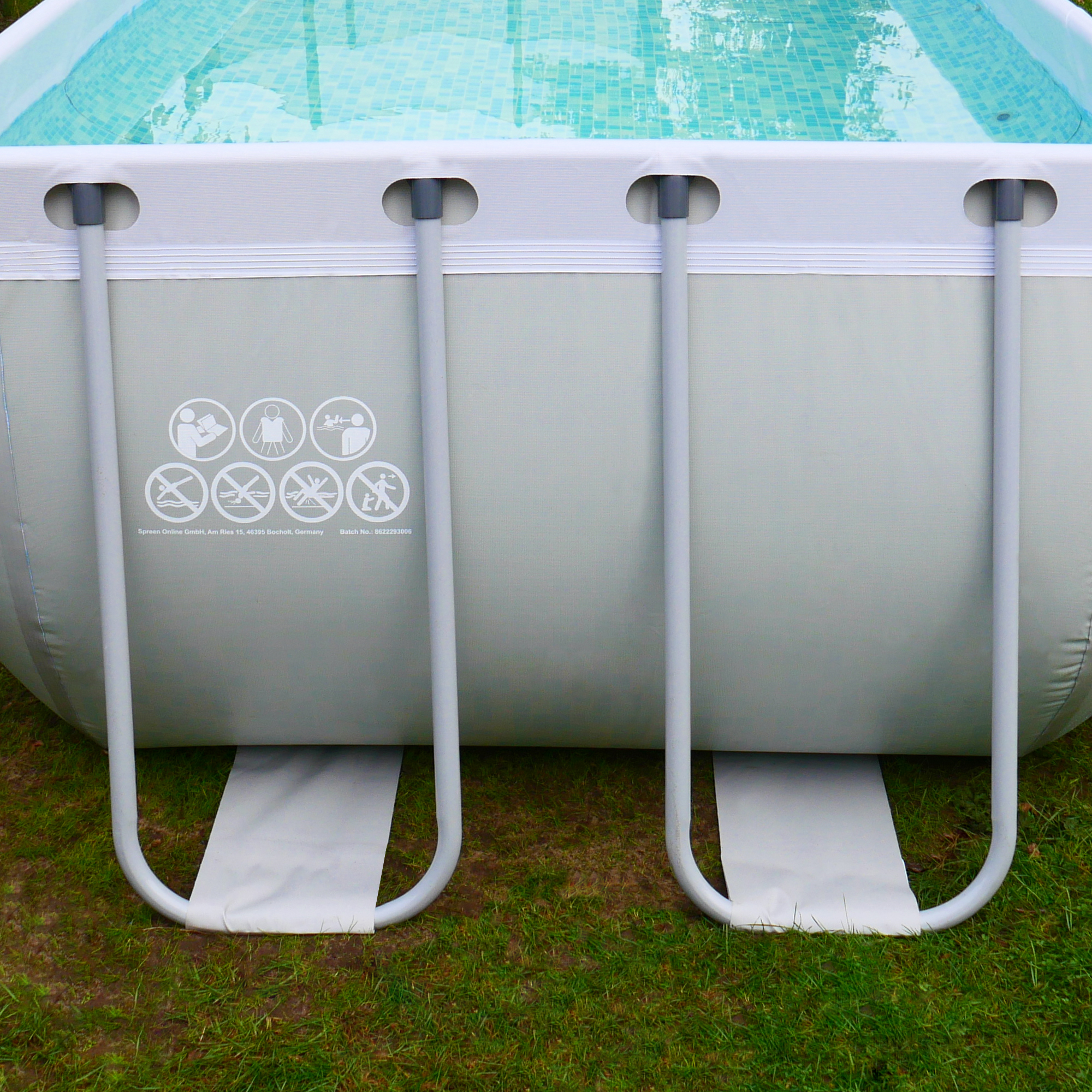 Rectangular your GEAR family pool with steel frame, light grey and white exterior, reinforced vinyl liner, visible safety icons, and supporting legs on grass. Ideal for garden or terrace use, dimensions 396 x 207 x 100 cm.