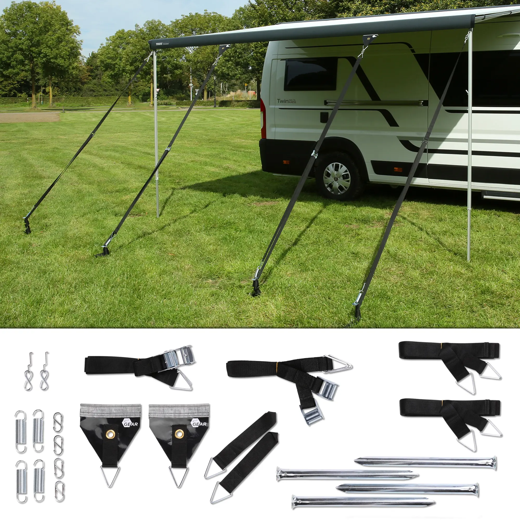 4-point awning storm securing set by your GEAR for caravans, with black tension straps, metal stakes, springs, and mounting accessories, shown securing a camper awning outdoors. Ideal for wind protection.