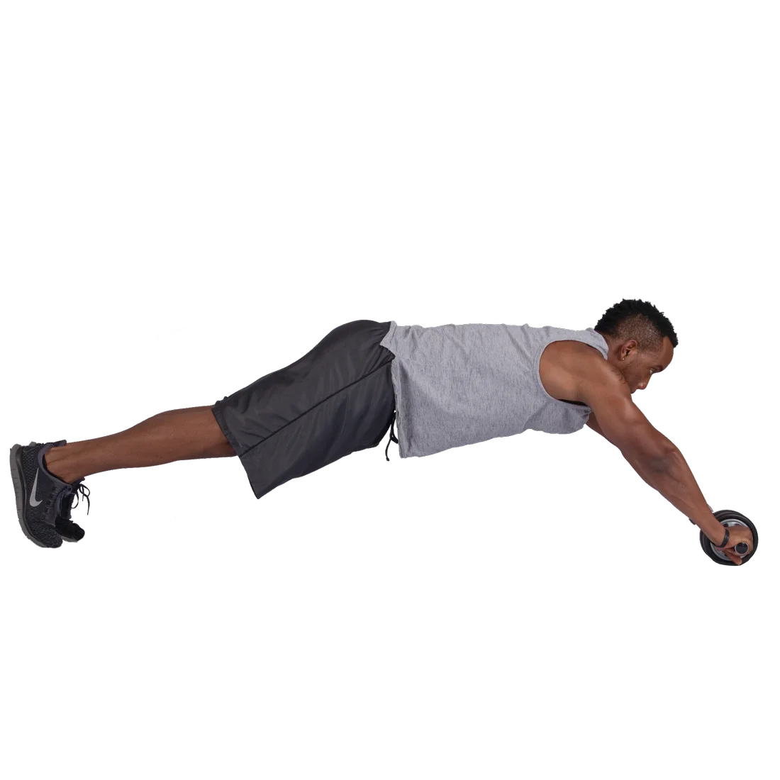 Mann trainiert mit dem Spirit Carnegie Ab Toner Roller Bauchtrainer, hält sich an den Griffen des Dual Wheels, ausgestreckte Körperhaltung, geeignet für Bauch- und Rückenmuskulatur, Fitnessprodukt für Zuhause.