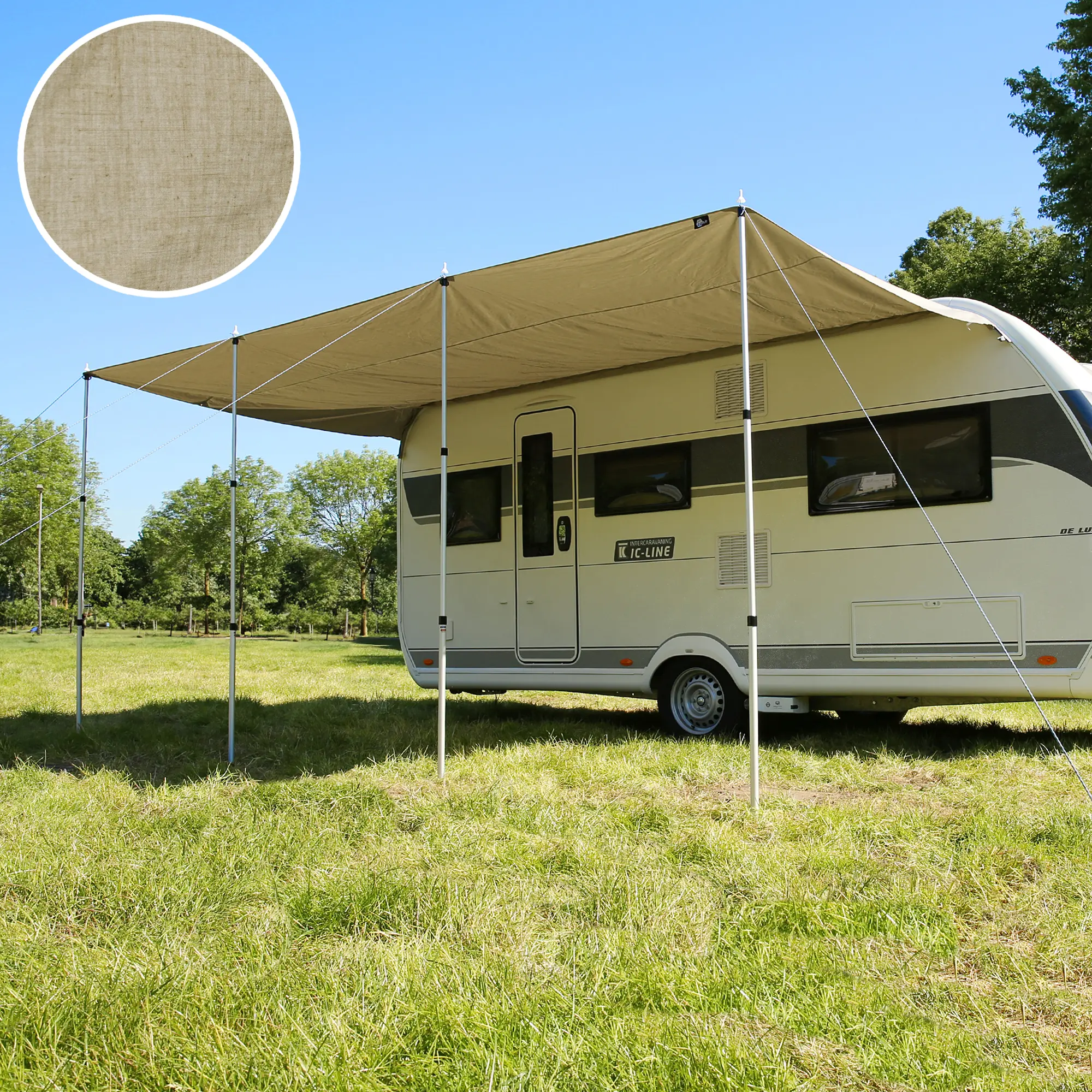 Beige your GEAR Caravan Tarp TC 500 x 240 cotton blend sun canopy attached to a caravan, supported by three aluminum telescopic poles, pitched on grassy field, fabric detail shown in inset.