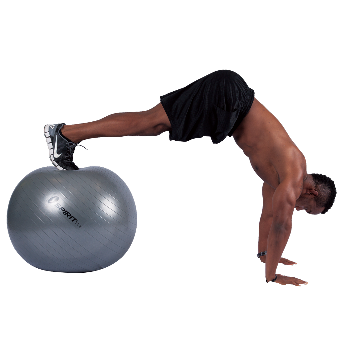 Man exercising with a grey Spirit TCR gymnastics ball (Ø 75 cm), demonstrating core and balance training. The ball features a durable, anti-burst surface and visible Spirit branding. Suitable for fitness, yoga, and office use.