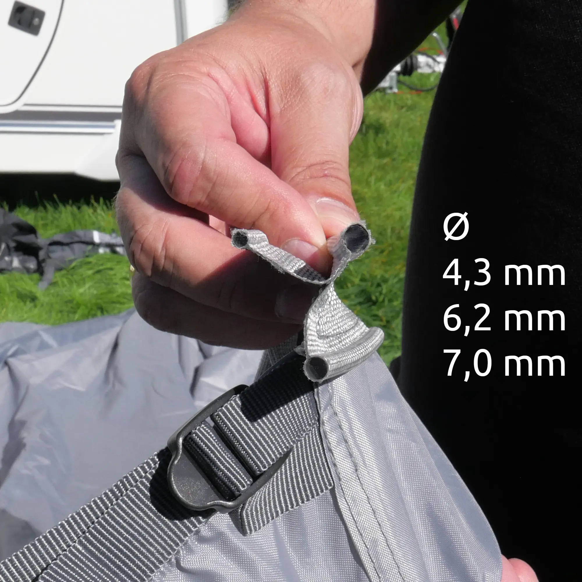 Close-up of a hand holding the triple keder strip of the your GEAR Vicenza 350E AIR inflatable caravan awning, showing three different diameters: 4.3 mm, 6.2 mm, and 7.0 mm for easy attachment.