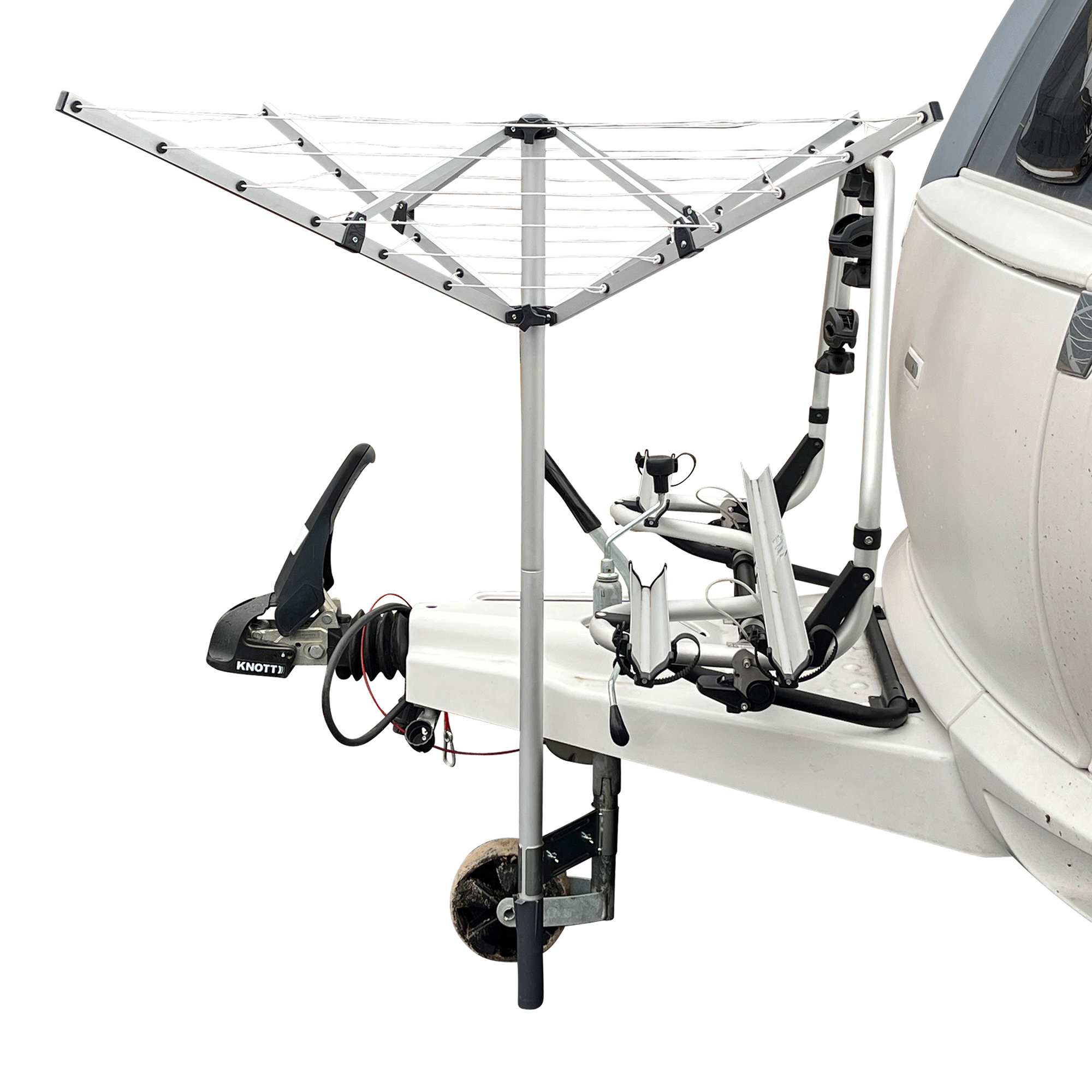 Aluminum rotary clothes dryer with 4 arms, mounted on a caravan support wheel using an adjustable clamp, ideal for mobile laundry drying; features multiple drying levels and lightweight, portable design.
