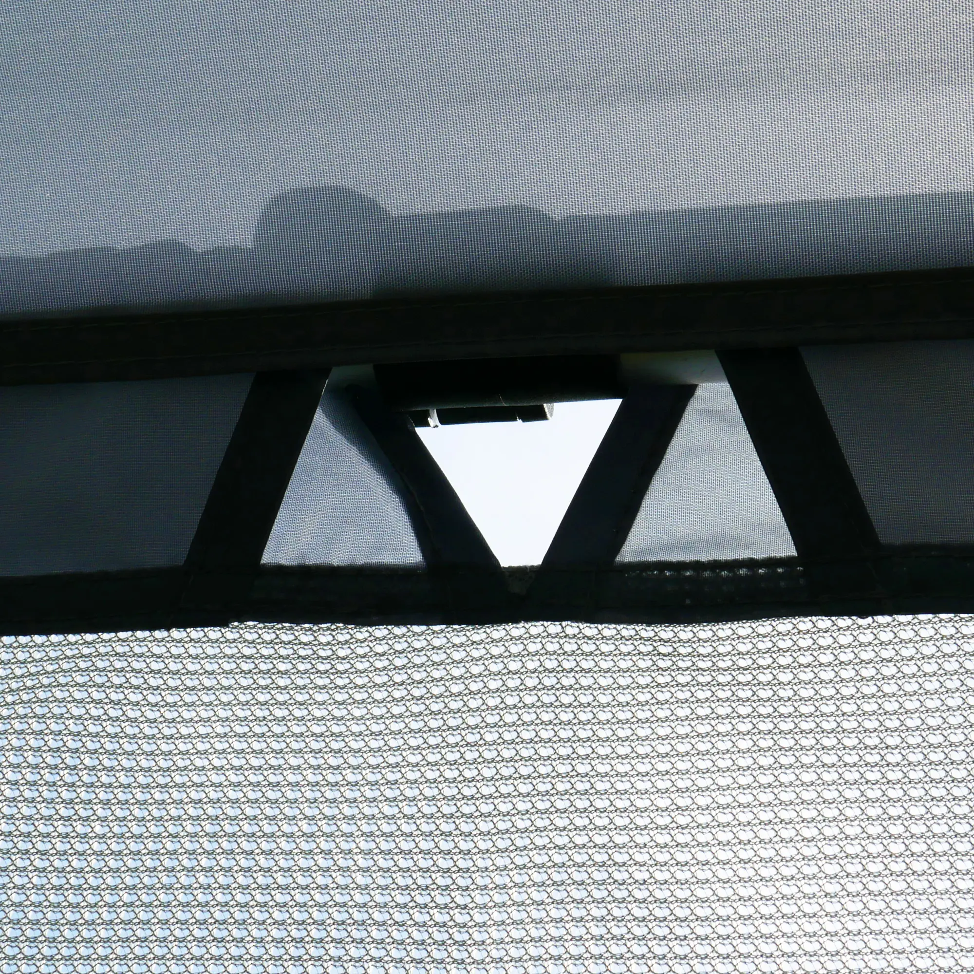 Close-up of the your GEAR Procida sun blocker front wall for caravan canopies, showing durable mesh fabric, reinforced seams, and attachment channel for easy installation on awning poles.