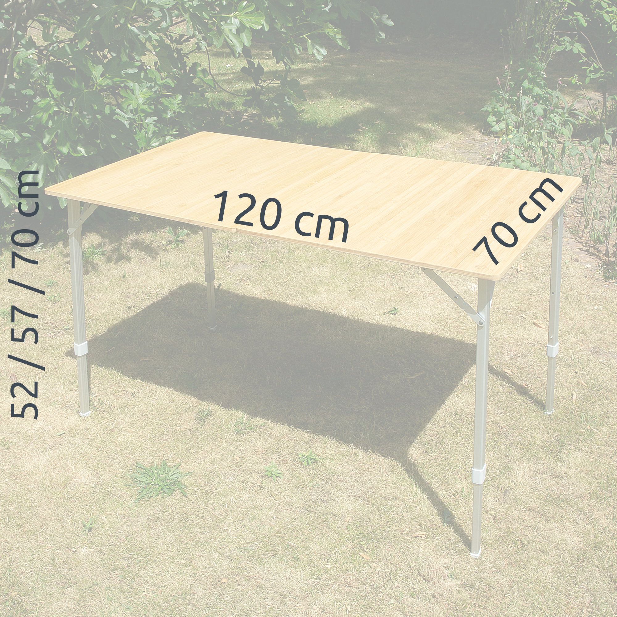 Bamboo camping table your GEAR Portofino XL for 6 people, 120x70 cm tabletop, adjustable aluminum legs with heights 52/57/70 cm, outdoor use, set up on grass, natural bamboo surface visible.