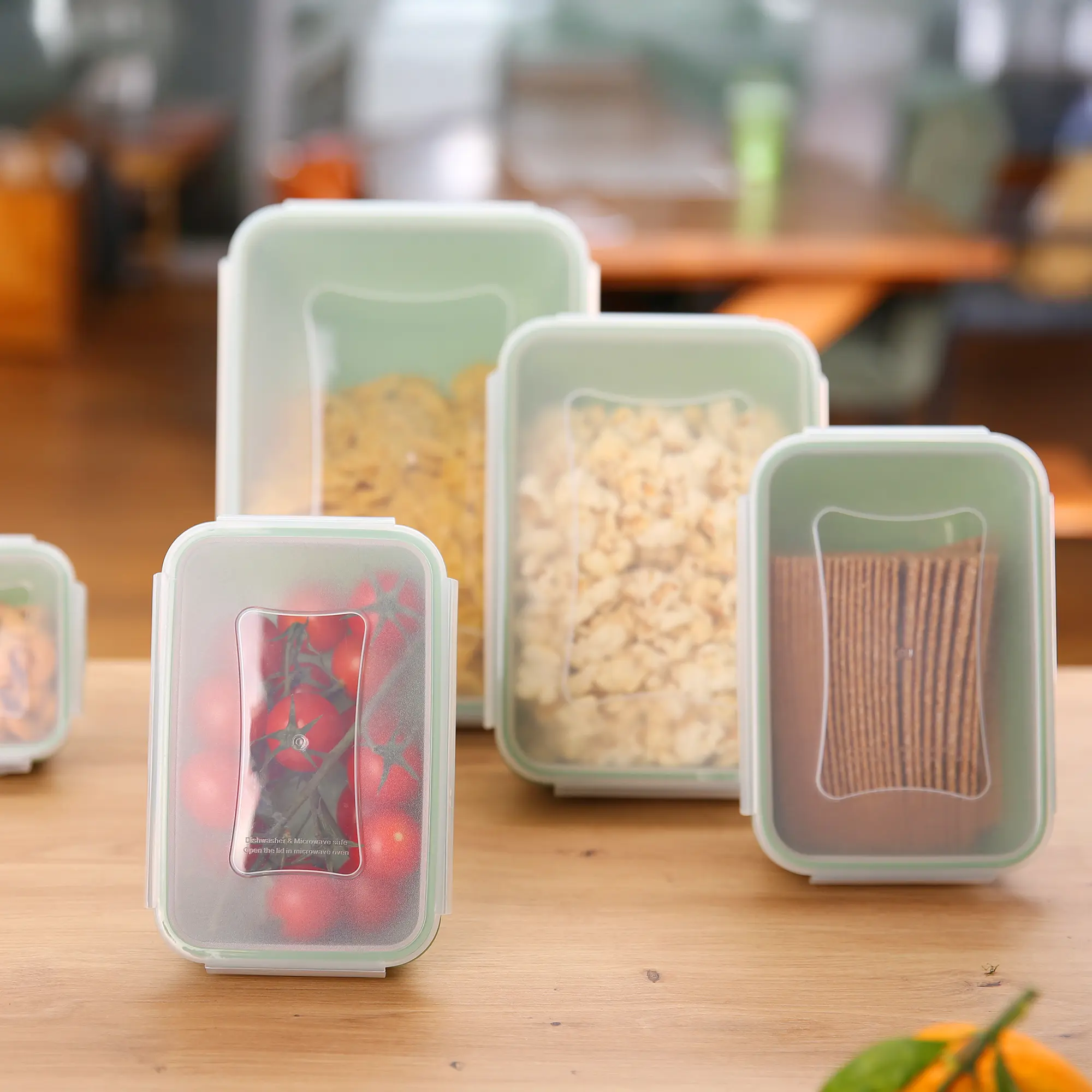 Set of 6 your GEAR Pila food storage containers, 300 ml each, with transparent lids, stackable, BPA-free, suitable for fridge, microwave, freezer, and dishwasher, shown filled with various foods on a kitchen table.