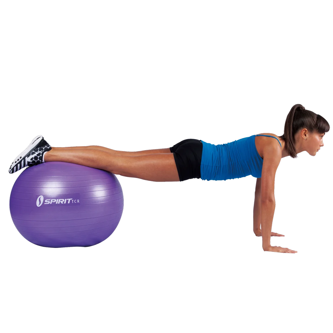 Mujer haciendo ejercicio con un balón de gimnasia Spirit TCR morado de 65 cm, ideal para fitness, yoga y entrenamiento de equilibrio, sobre fondo blanco.