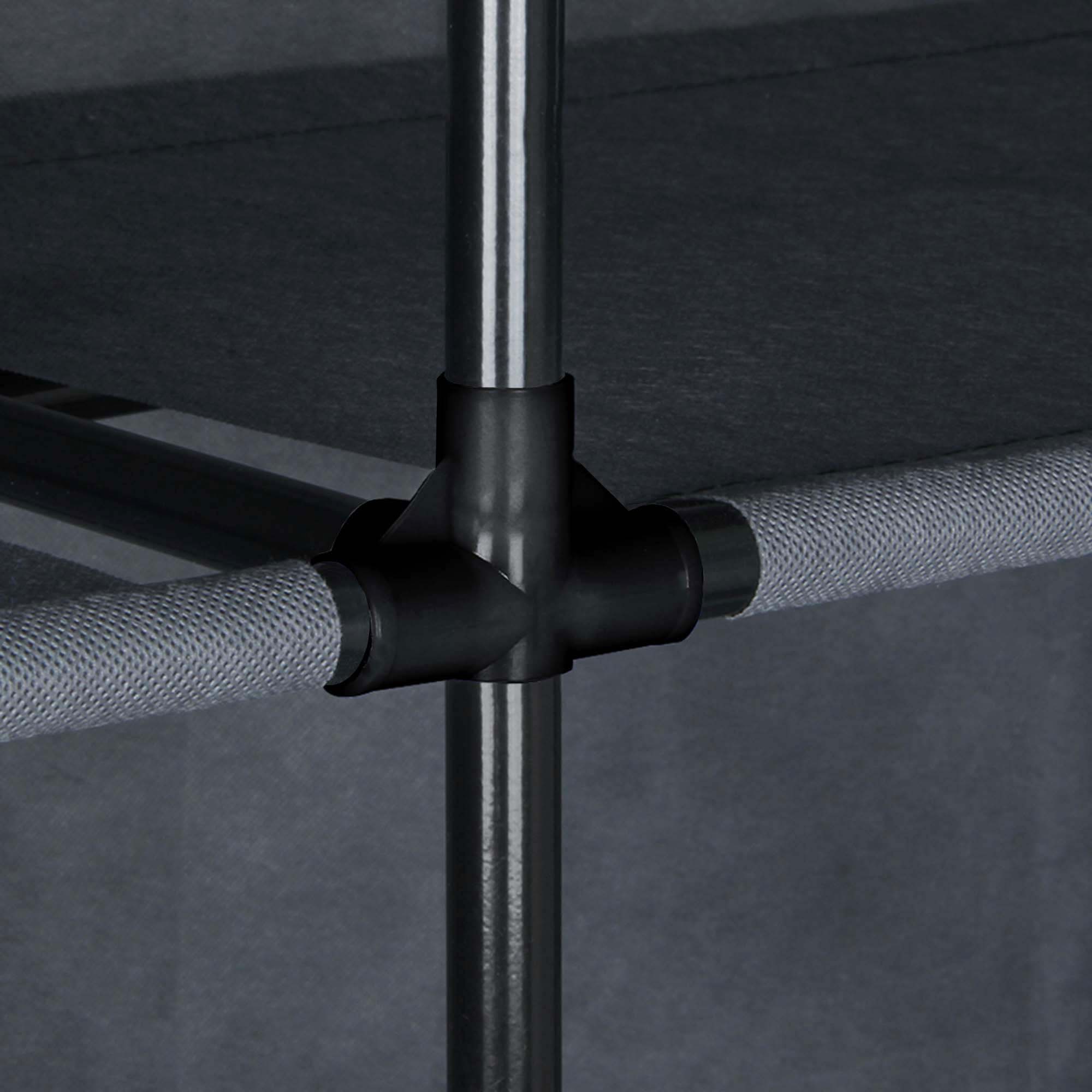 Close-up of the yourGEAR Grado fabric wardrobe frame, showing sturdy black metal tubes, plastic connectors, and grey fabric shelves, highlighting the stable and modular construction of the 105x45x180cm closet.