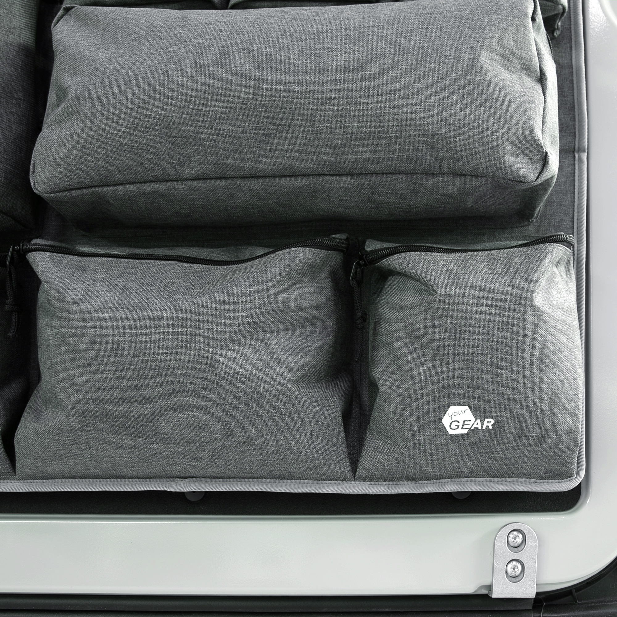 your GEAR Ortles R organizer for camper van rear door, right side; features multiple grey fabric pockets with zippers for efficient storage of tools and accessories; visible your GEAR logo on lower pocket.