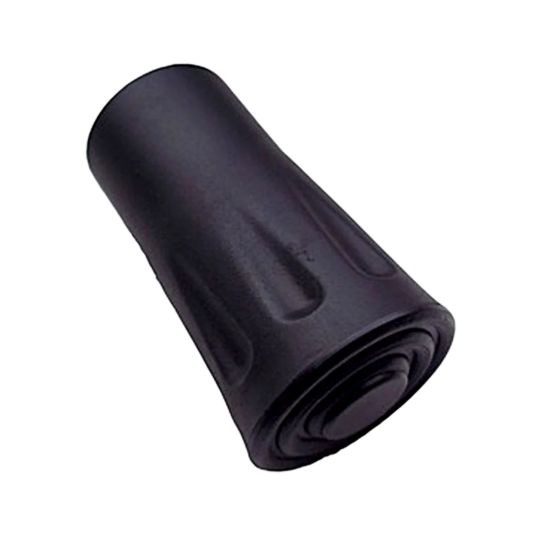 Embout de protection Trekmates Grip-Cap noir pour bâton de randonnée, en plastique résistant, forme cylindrique avec rainures antidérapantes et base circulaire, conçu pour protéger la pointe sur routes et chemins.