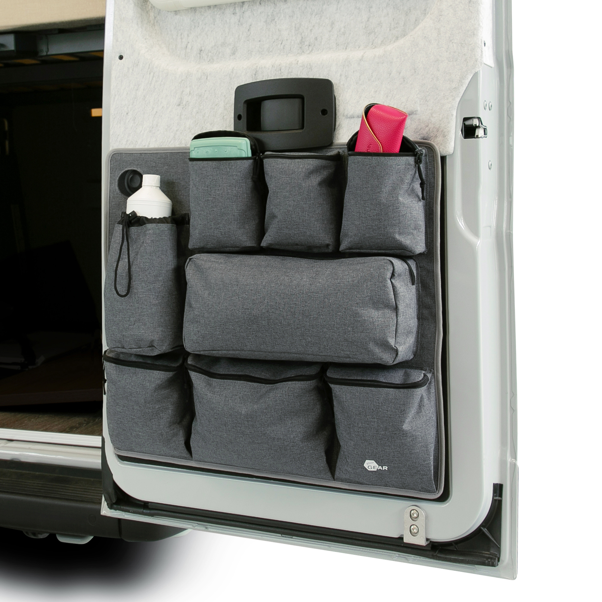 your GEAR Ortles R organizer for camper van rear right door, featuring 8 grey storage pockets in various sizes, securely attached and holding travel accessories like bottles and bags for efficient organization.