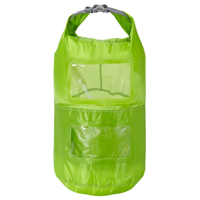Trekmates 15L dry bag in bright green, featuring two transparent viewing windows, roll-top closure with buckle, lightweight nylon material, and two separate compartments for organized waterproof storage.