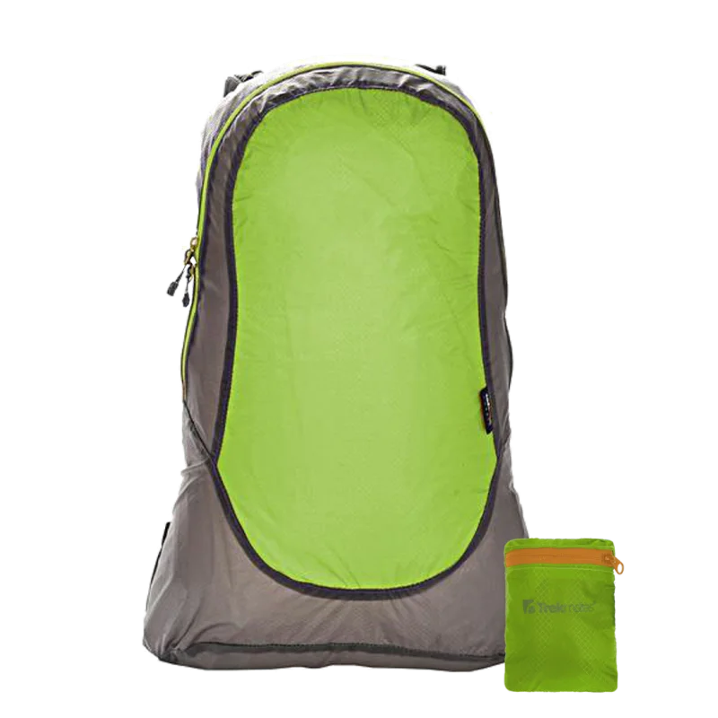Lightweight Trekmates Daypack 20L in green and grey nylon, compact foldable design, shown with matching small pack pouch. Ideal waterproof hiking backpack for travel, camping, and outdoor activities.