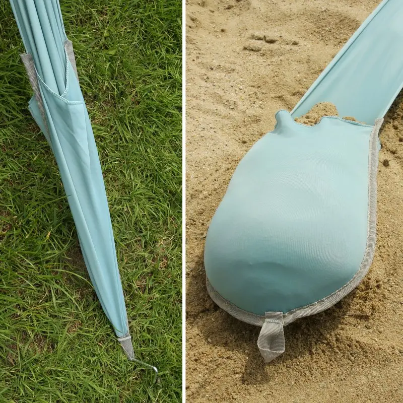 Detail view of your GEAR Cameo Beach Shelter XXL, showing light blue Lycra fabric, reinforced seams, sand pocket for secure anchoring, and a compact pack size suitable for grass and sand surfaces.