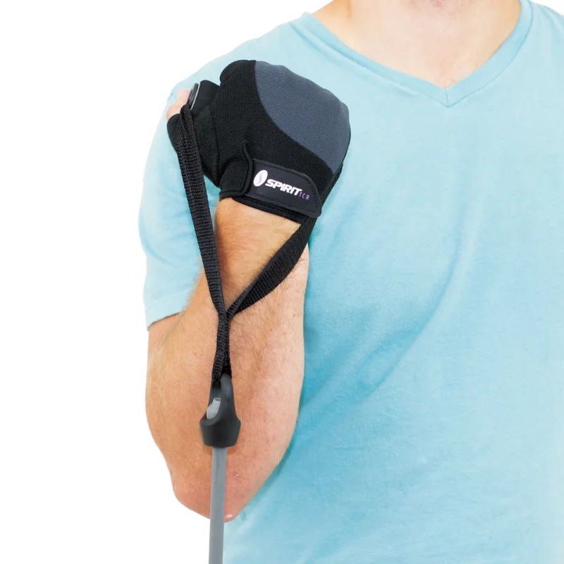Spirit Workout Glove S fitness glove in black with padded palm, worn on hand, adjustable strap, and Spirit TCR logo, shown gripping a fitness bar; suitable for strength and weight training.
