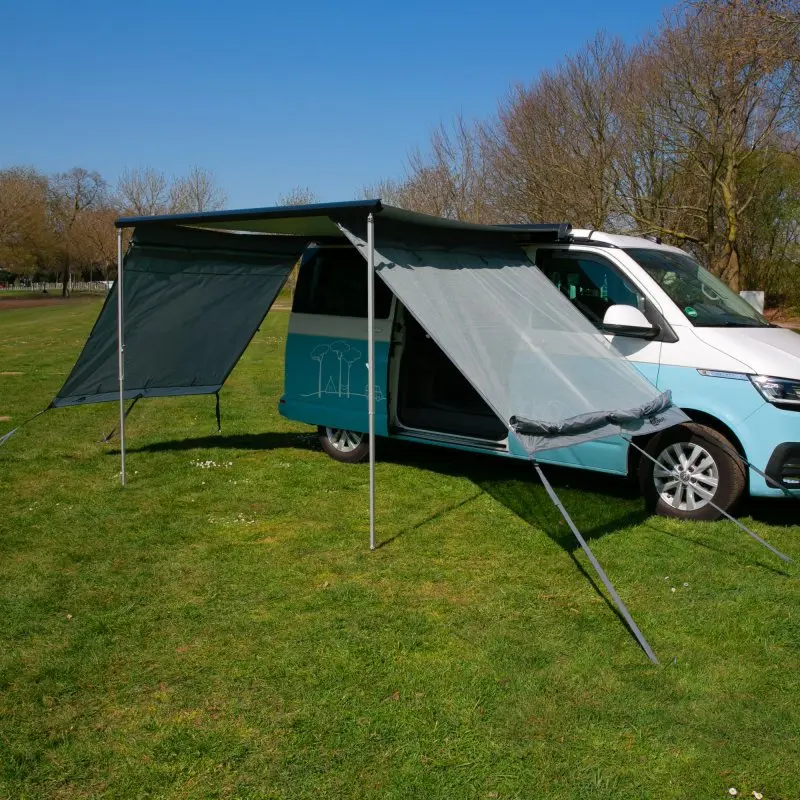 Camper van with your GEAR Sun + Rain Blocker side walls, 2 side panels mounted on awning, providing sun and rain protection, wind-permeable fabric on one side, opaque rain cover on the other, suitable for 2m awnings.