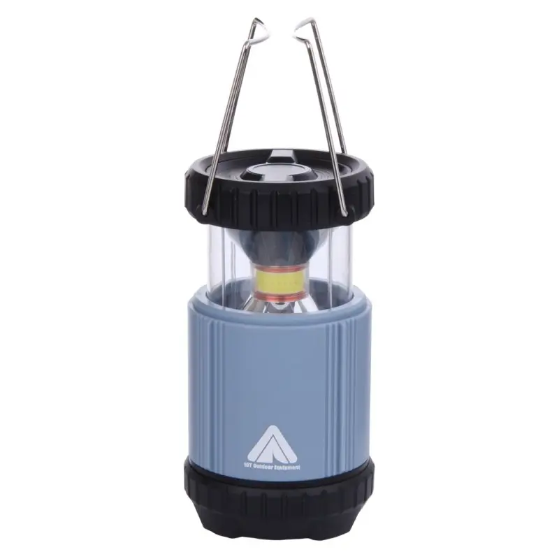 Blue 10T COL 300 collapsible camping lantern with 300 lumens COB LED, black top and base, transparent light chamber, metal carrying handles, and 10T Outdoor Equipment logo on the body, suitable for outdoor use.