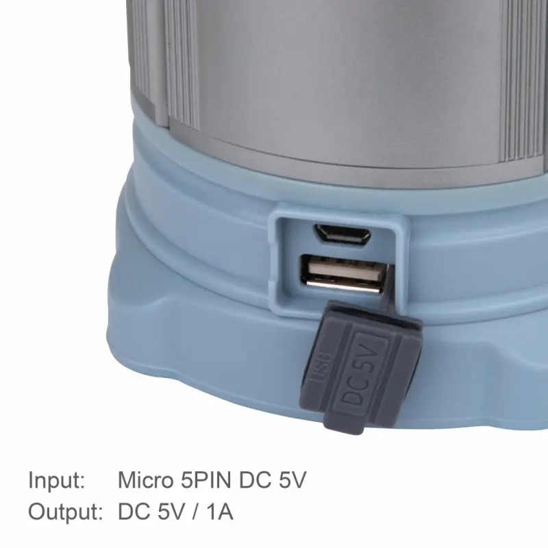 Close-up of the 10T CPL 185 camping lantern in blue, showing its micro USB input and standard USB output ports with protective cover, highlighting the integrated 4800mAh power bank feature.
