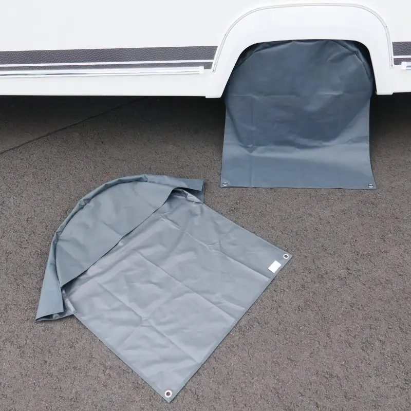 yourGEAR wheel cover set for 16/17 inch caravan and motorhome tires, shown as two grey UV-protective covers; one installed on a wheel, the other laid flat on asphalt, highlighting material and size.