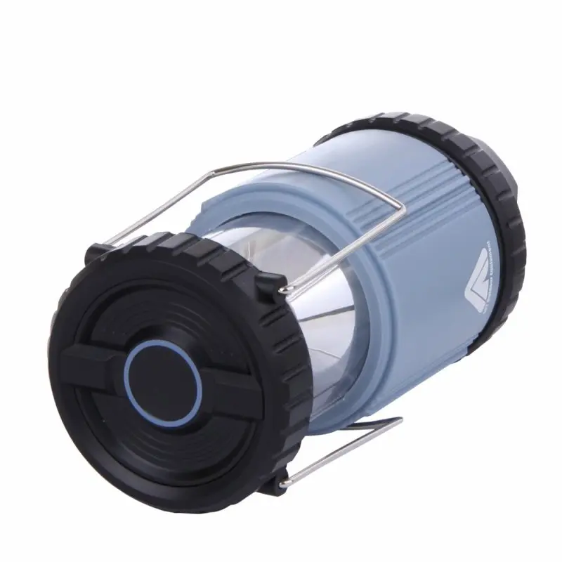 Blue 10T COL 300 camping lantern with 300 lumens, COB LED 5W, cylindrical shape, black ends, foldable metal handles, and robust ABS plastic body, shown in a collapsed position.