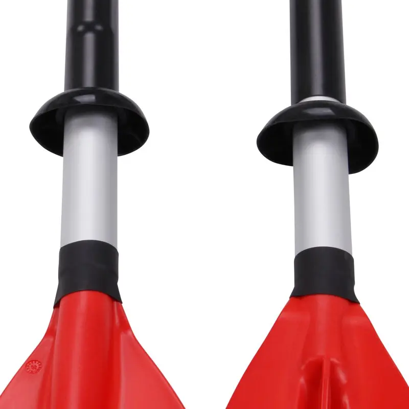Close-up of two red kayak paddles with black and silver shafts, positioned vertically against a white background.