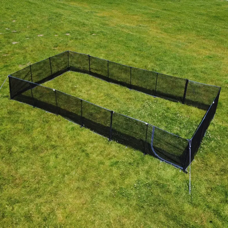Mobile dog fence your GEAR Larino 400, rectangular, black mesh panels with zipper door, 90 cm high, set up on grass, modular and expandable, ideal for camping and garden use.