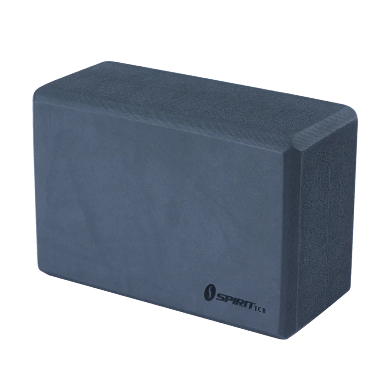 Dark grey Spirit Yoga block made of firm foam, size 23x15x10 cm, with rounded edges and Spirit TCR logo, designed for stability and support during yoga, Pilates, and fitness workouts.