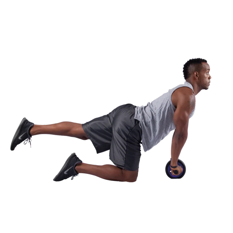 Man using Spirit Carnegie Ab Toner Roller with dual wheels and brake, performing ab exercise on one knee. Ideal for strengthening abdominal and back muscles at home or gym. Fitness equipment in use.