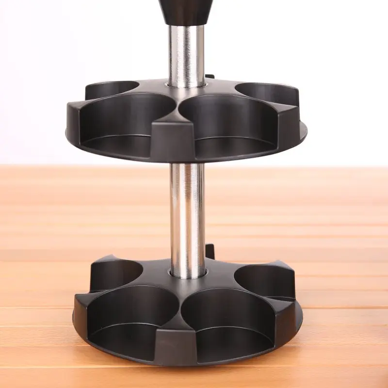 your GEAR spice carousel with two black circular tiers, each with six compartments for spice jars, mounted on a metal rod, shown on a wooden surface, ideal for kitchen spice organization.