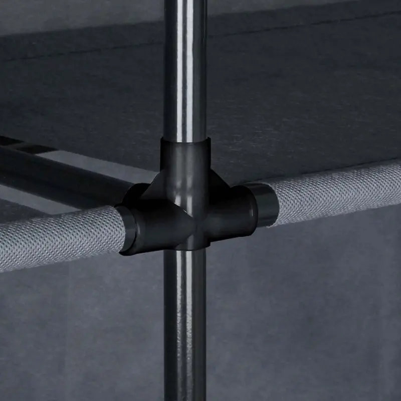 Close-up of yourGEAR Grado fabric wardrobe frame, showing sturdy black plastic connectors joining metal rods and a fabric shelf, highlighting stable construction and modern grey color. Ideal for clothes storage.