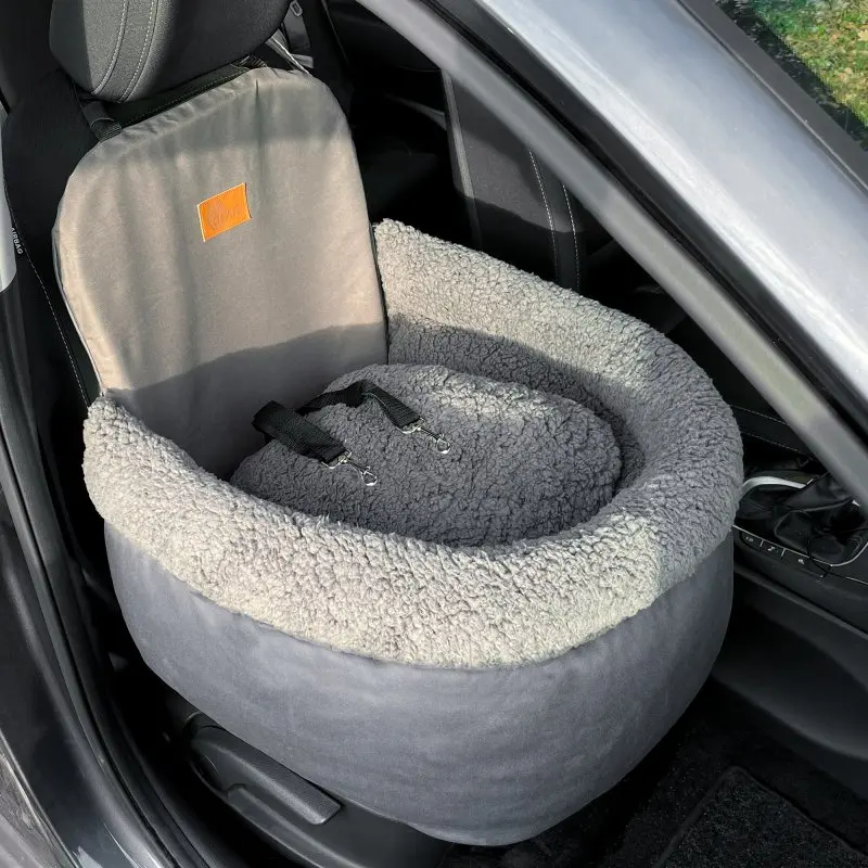 your GEAR Frontera dog car seat in grey with high padded sides, soft fleece lining, two adjustable safety leashes, and seatbelt attachment, placed on a car front seat for secure pet travel.