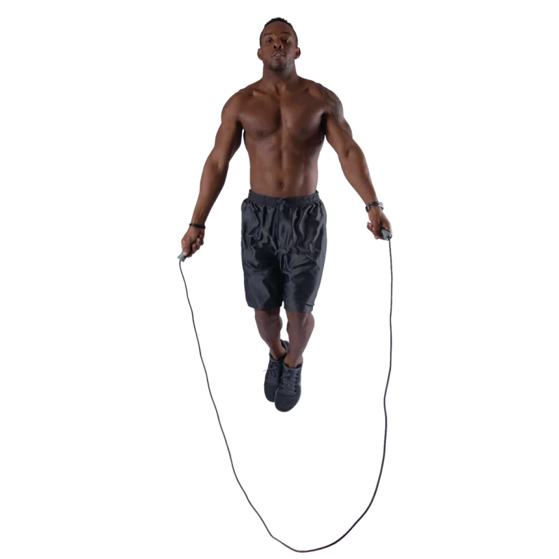 Shirtless man jumping with the Spirit Speed Rope fitness skipping rope, black handles and cord, wearing black shorts and sneakers. Ideal for daily workout, boxing, and cardio training. Isolated on white background.