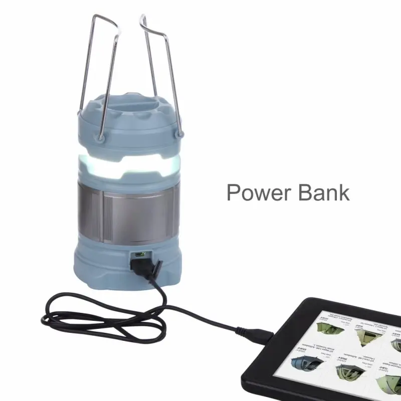 Blue 10T CPL 185 camping lantern with 15 LEDs, 185 lumens, and 4800mAh power bank function, shown charging a device via USB; sturdy metal handles and 360-degree illumination. Ideal for outdoor use.