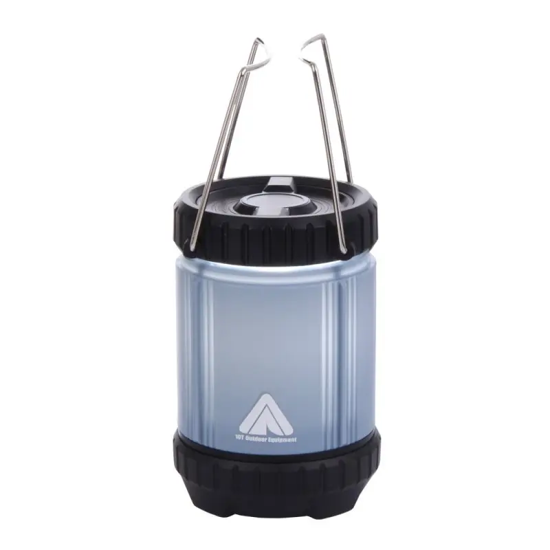 Blue 10T COL 300 camping lantern with 300 lumens, cylindrical shape, black top and base, foldable metal handles, and 10T Outdoor Equipment logo on front. Suitable for outdoor use, compact and portable.