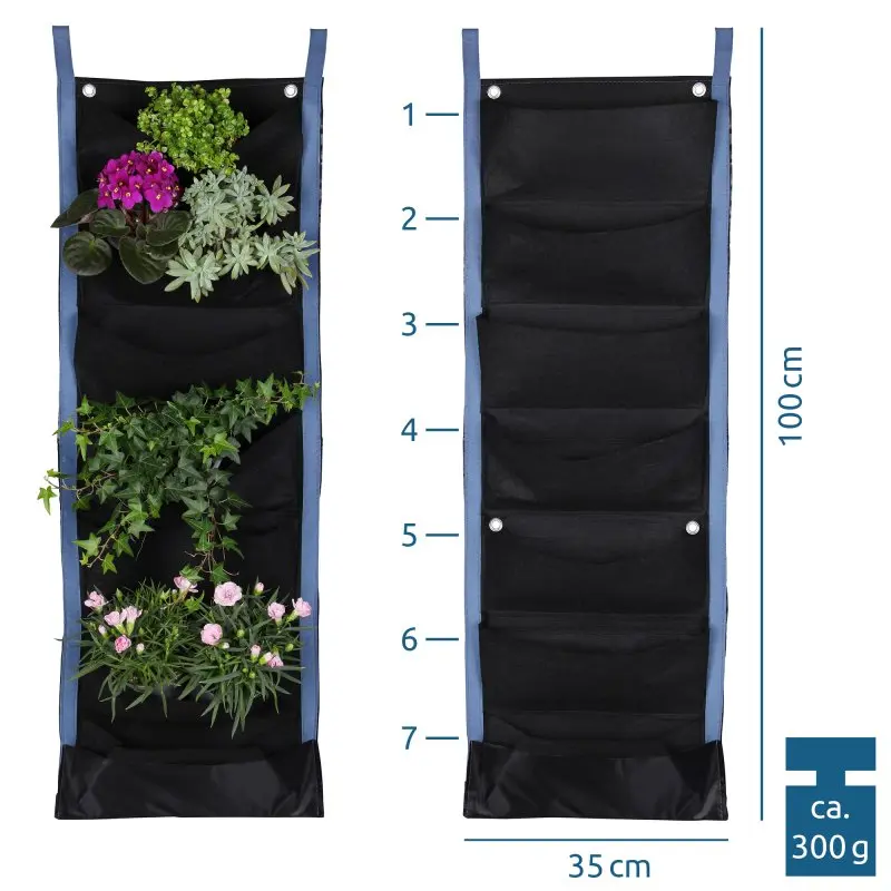 Mur végétal yourGEAR Growbag, noir, 7 poches en feutre, bordures bleues, 100x35 cm, fixation murale, pour plantes et herbes, léger et réutilisable, exemple de plantation sur la moitié gauche.