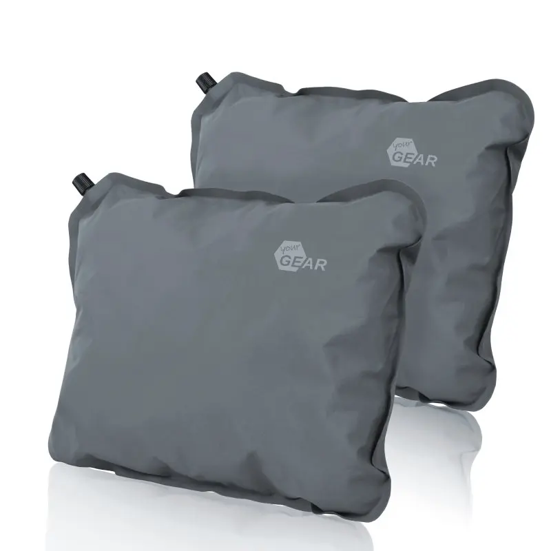 Two grey yourGEAR travel pillows, 40x30cm each, self-inflatable with soft foam filling, compact and lightweight, shown with valves for inflating, ideal for camping or travel.