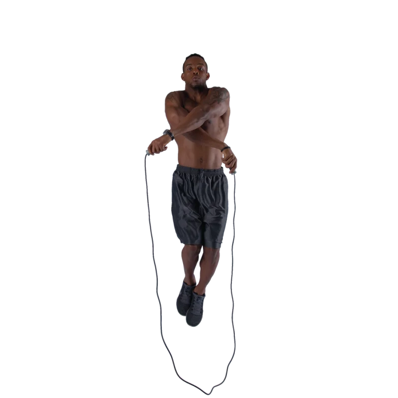 Man jumping with Spirit Speed Rope skipping rope, shirtless, wearing black shorts and black athletic shoes, demonstrating fitness workout. Ideal for boxing, cardio, endurance, and coordination training.