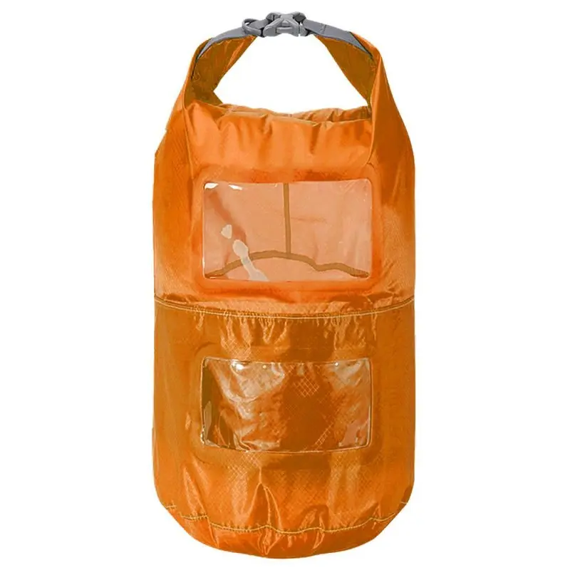 Sac étanche Trekmates orange 6L avec deux compartiments, fenêtres transparentes pour visibilité, fermeture roulée avec boucle grise, en nylon léger, idéal pour l'organisation et la protection contre l’eau.