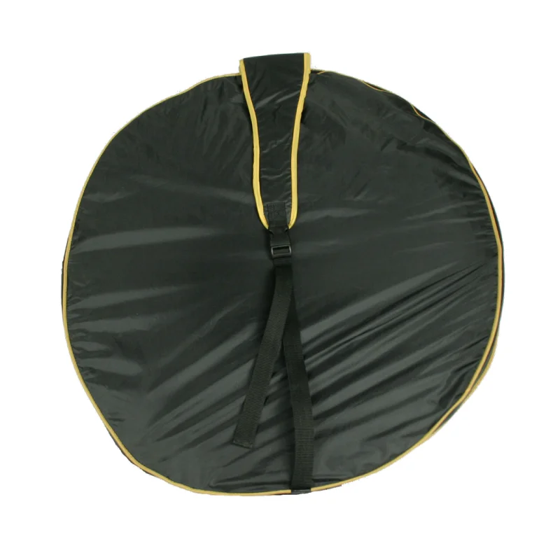 Black round carrying bag with yellow edges and a black strap, designed for the 10T Soccer Goal Pop-Up portable football goal, ideal for easy transport and storage of the foldable mini goal for outdoor use.