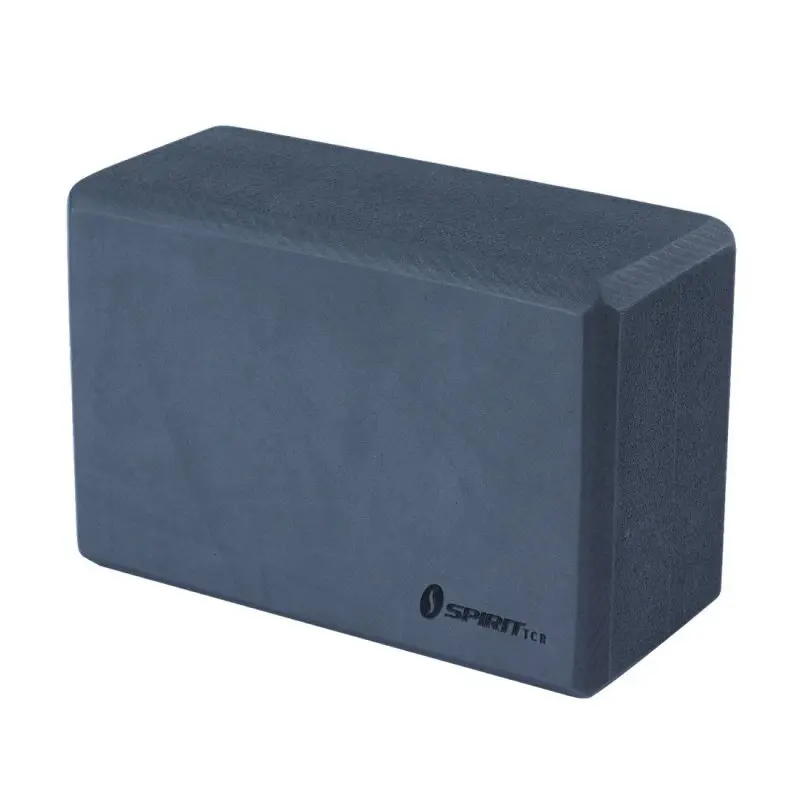 Spirit Yoga block made of dense dark foam, dimensions 23x15x10 cm, with beveled edges and Spirit TCR logo printed on the front, designed for yoga, Pilates, and workout support.