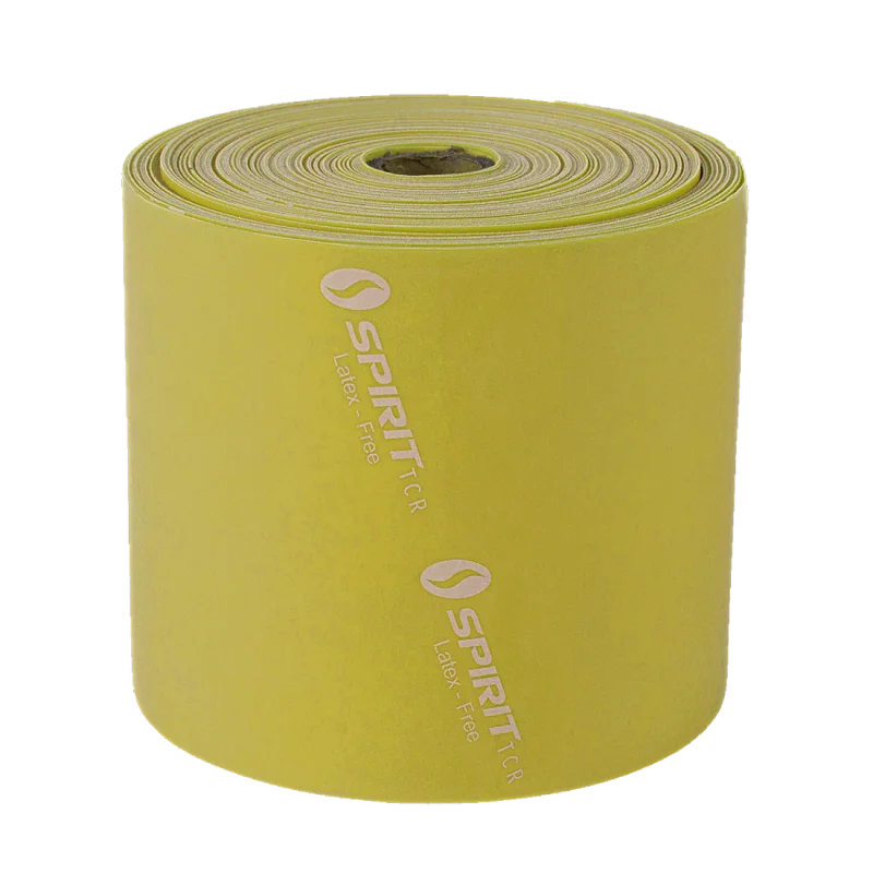 Yellow Spirit Fitnessband, 22.8m roll, latex-free, with 9kg resistance. The band features the Spirit TCR logo and is designed for versatile strength and rehabilitation training.