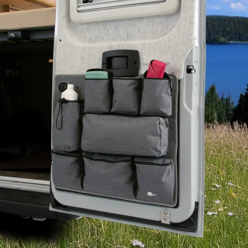 your GEAR Ortles R organizer with 8 gray storage pockets, mounted on the right rear door of a camper van, holding various travel items; ideal for maximizing storage in camper vans and motorhomes.
