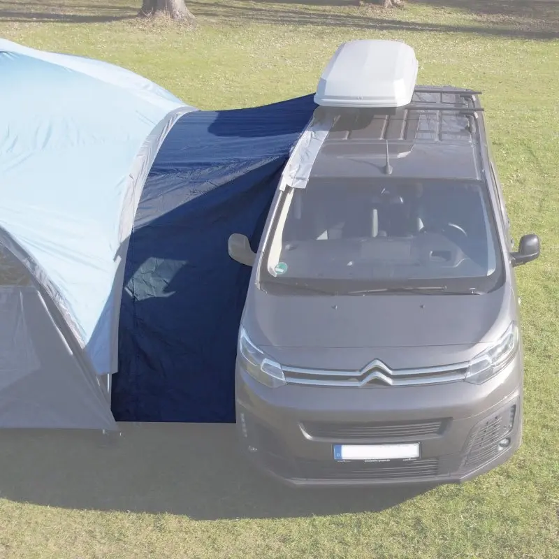 your GEAR Bergamo 430 Bus Connector shown attached between a pavilion and a camper van, providing a weather-protected connection with visible zippers and keder rails for secure mounting.